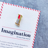 imagination greeting card and varsity letter pin