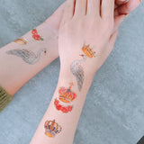 swan and gold metallic crown temporary tattoo