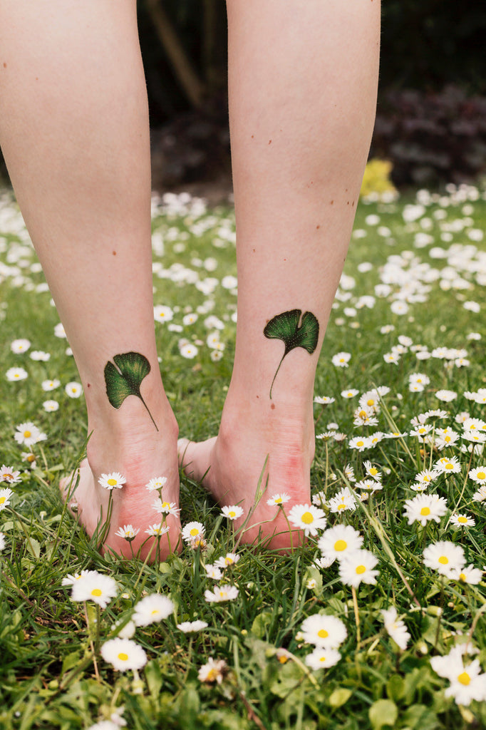 Green Leaf Tattoo On Left Foot